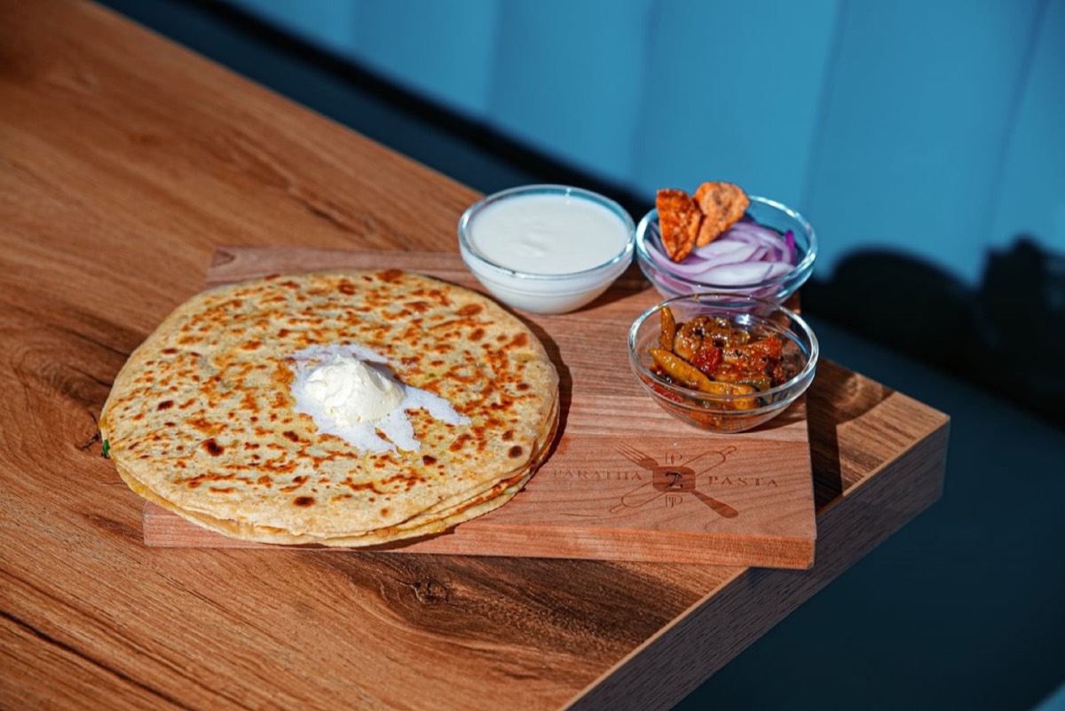 Paratha with butter, yogurt and pickle